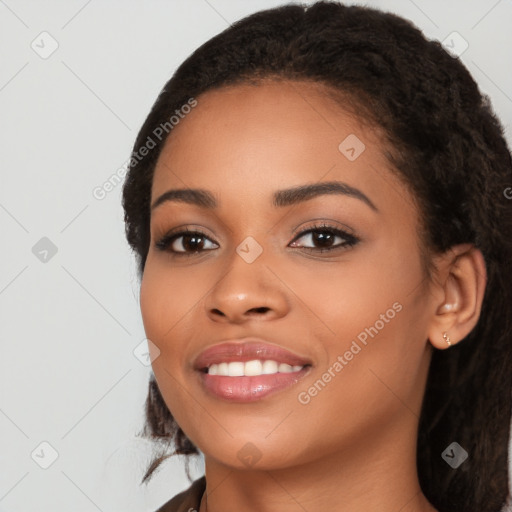 Joyful latino young-adult female with long  black hair and brown eyes