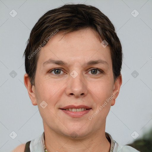 Joyful white adult female with short  brown hair and grey eyes