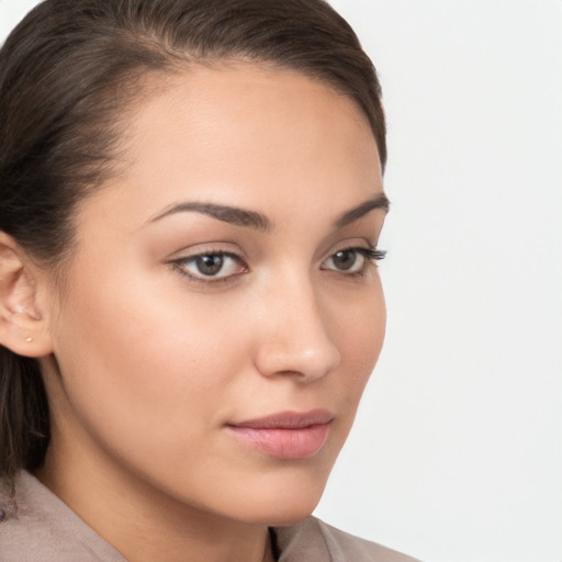 Neutral white young-adult female with medium  brown hair and brown eyes