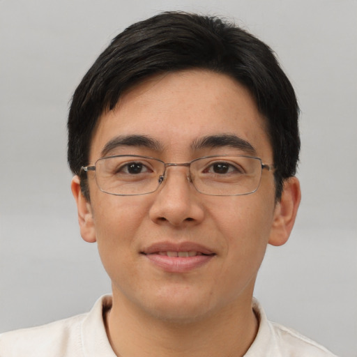 Joyful asian young-adult male with short  brown hair and brown eyes