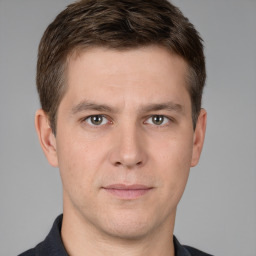 Neutral white young-adult male with short  brown hair and grey eyes
