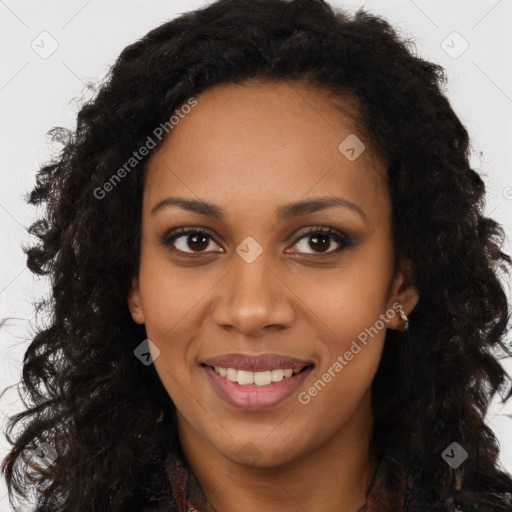 Joyful black young-adult female with long  brown hair and brown eyes