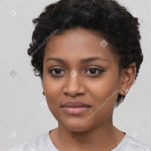 Joyful black young-adult female with short  black hair and brown eyes