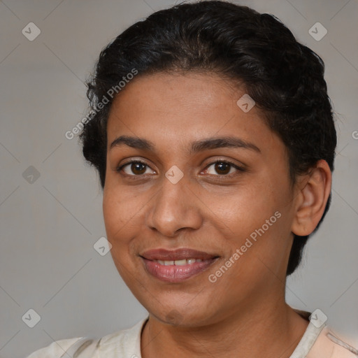 Joyful latino young-adult female with short  brown hair and brown eyes