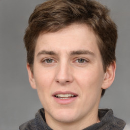 Joyful white adult male with short  brown hair and grey eyes