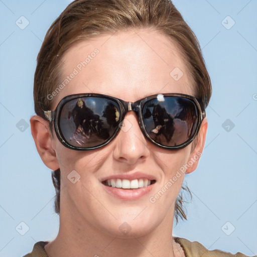 Joyful white young-adult female with medium  brown hair and blue eyes