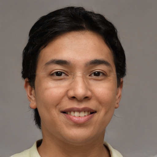 Joyful asian adult female with short  brown hair and brown eyes