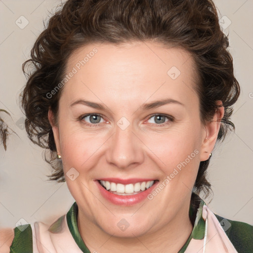 Joyful white young-adult female with medium  brown hair and green eyes