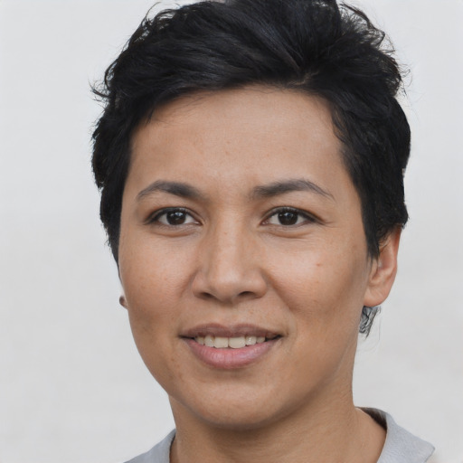 Joyful asian adult female with short  black hair and brown eyes