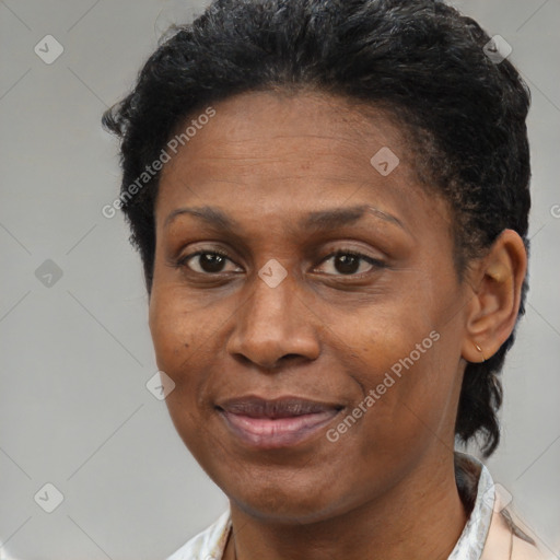 Joyful latino adult female with short  brown hair and brown eyes