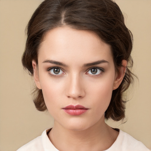 Neutral white young-adult female with medium  brown hair and brown eyes