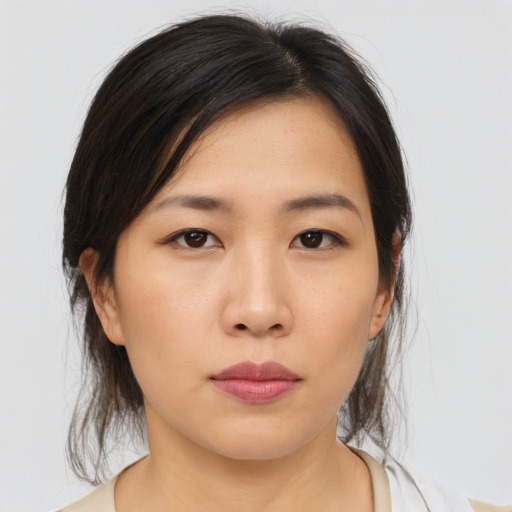 Neutral asian young-adult female with medium  brown hair and brown eyes