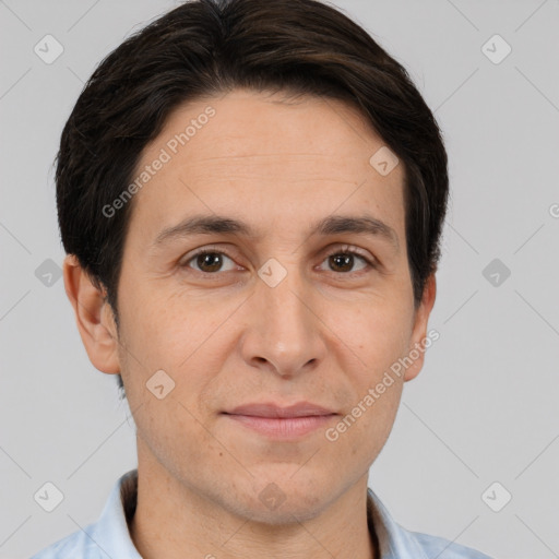 Joyful white adult male with short  brown hair and brown eyes