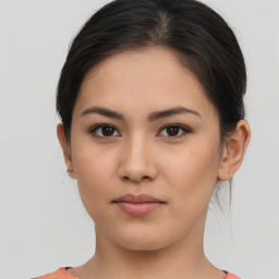 Neutral asian young-adult female with medium  brown hair and brown eyes