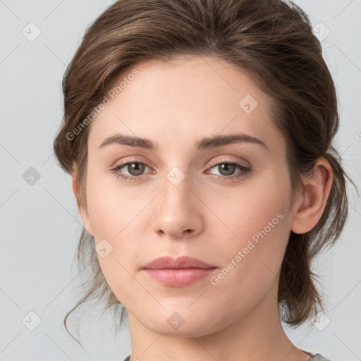 Joyful white young-adult female with medium  brown hair and green eyes