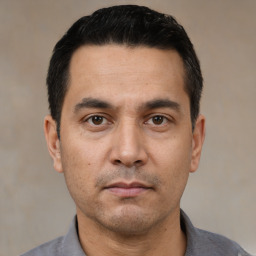 Neutral white adult male with short  black hair and brown eyes