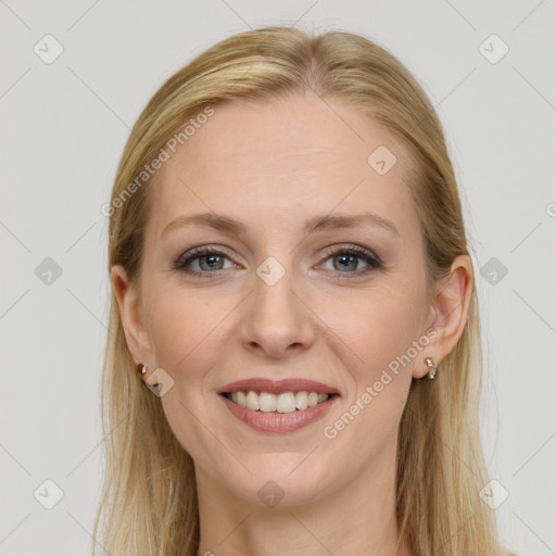 Joyful white young-adult female with long  brown hair and grey eyes