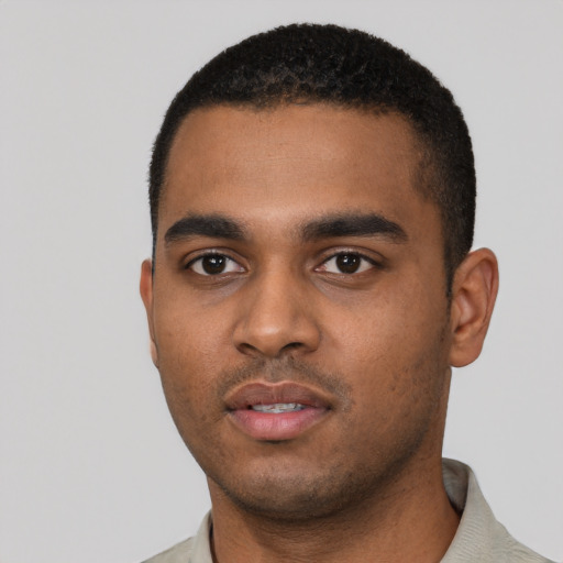 Neutral black young-adult male with short  black hair and brown eyes