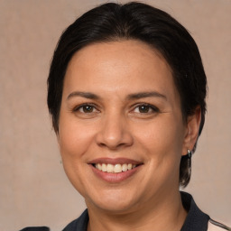 Joyful white adult female with medium  brown hair and brown eyes