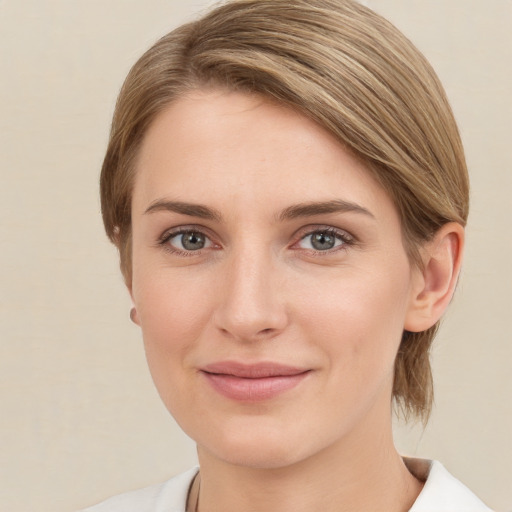 Joyful white young-adult female with medium  brown hair and grey eyes