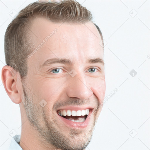 Joyful white young-adult male with short  brown hair and grey eyes