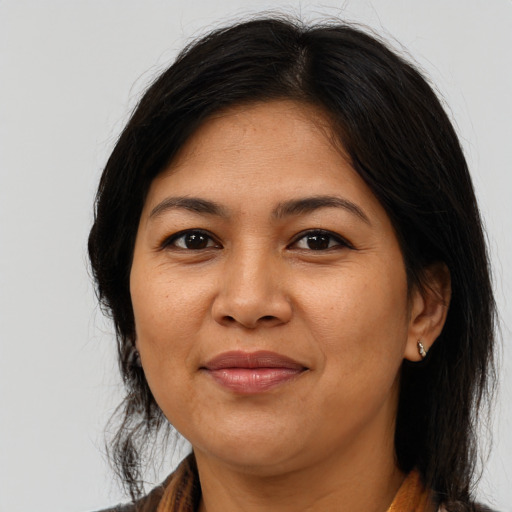 Joyful asian adult female with long  brown hair and brown eyes