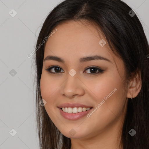 Joyful white young-adult female with long  brown hair and brown eyes