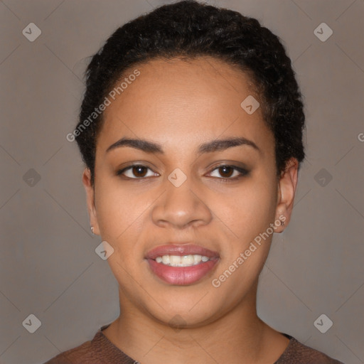 Joyful black young-adult female with short  black hair and brown eyes