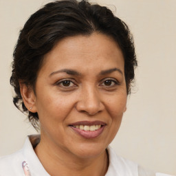 Joyful white adult female with short  brown hair and brown eyes