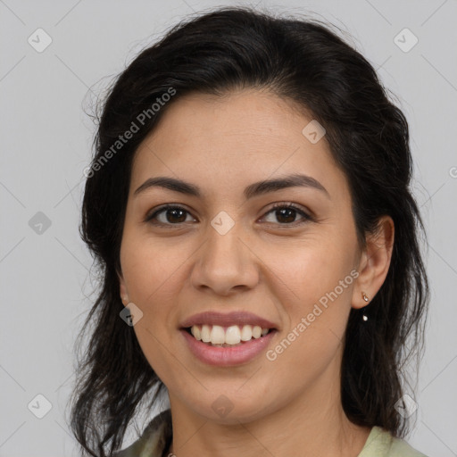 Joyful latino young-adult female with medium  brown hair and brown eyes