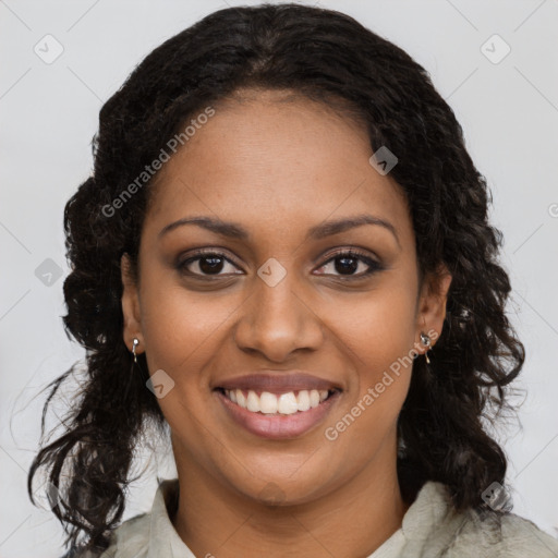 Joyful black young-adult female with long  brown hair and brown eyes