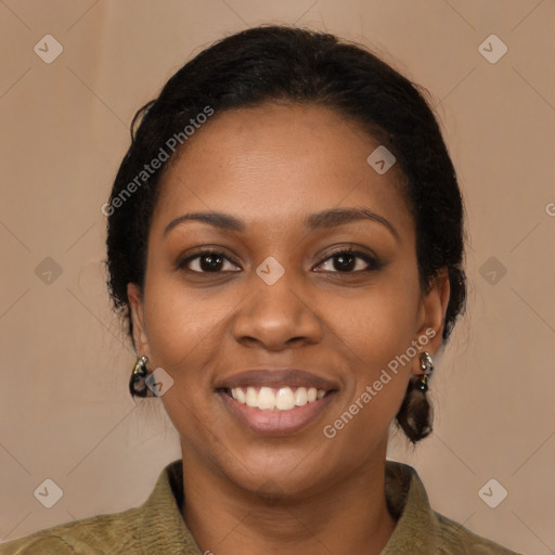 Joyful black young-adult female with medium  brown hair and brown eyes