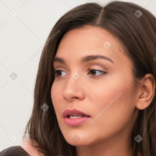 Neutral white young-adult female with long  brown hair and brown eyes