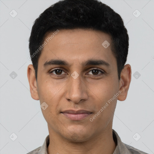 Joyful latino young-adult male with short  brown hair and brown eyes