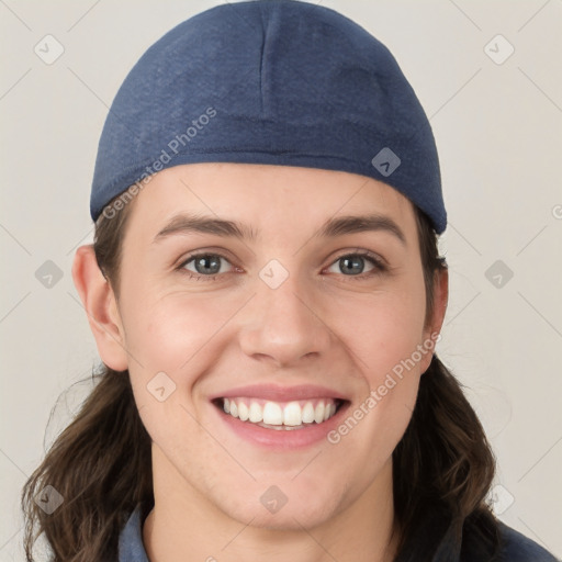 Joyful white young-adult female with medium  brown hair and grey eyes