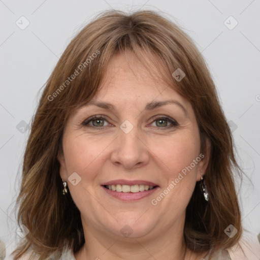 Joyful white adult female with medium  brown hair and grey eyes