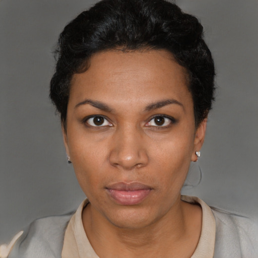 Neutral black young-adult female with short  black hair and brown eyes