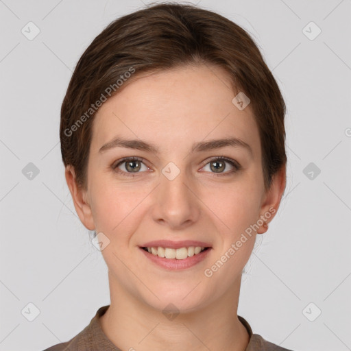 Joyful white young-adult female with short  brown hair and grey eyes