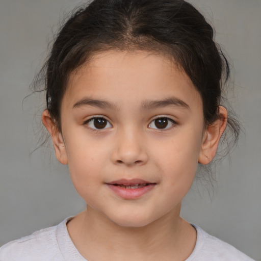 Joyful white child female with medium  brown hair and brown eyes