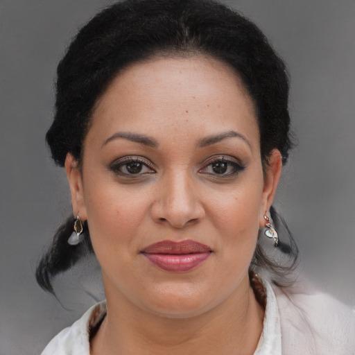 Joyful black young-adult female with medium  brown hair and brown eyes