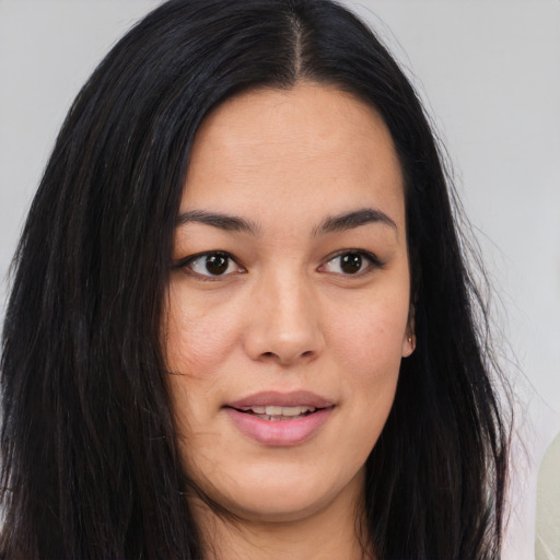Joyful asian young-adult female with long  brown hair and brown eyes