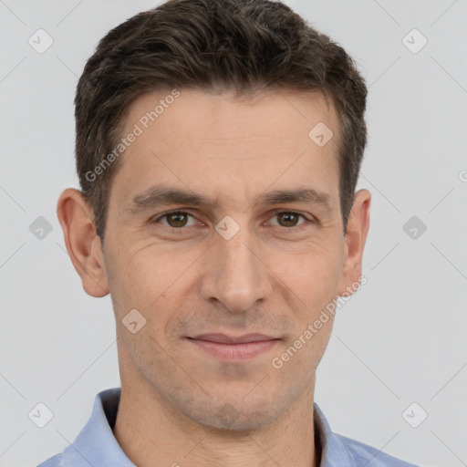 Joyful white adult male with short  brown hair and brown eyes