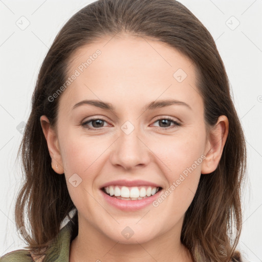 Joyful white young-adult female with long  brown hair and grey eyes