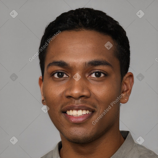 Joyful black young-adult male with short  black hair and brown eyes