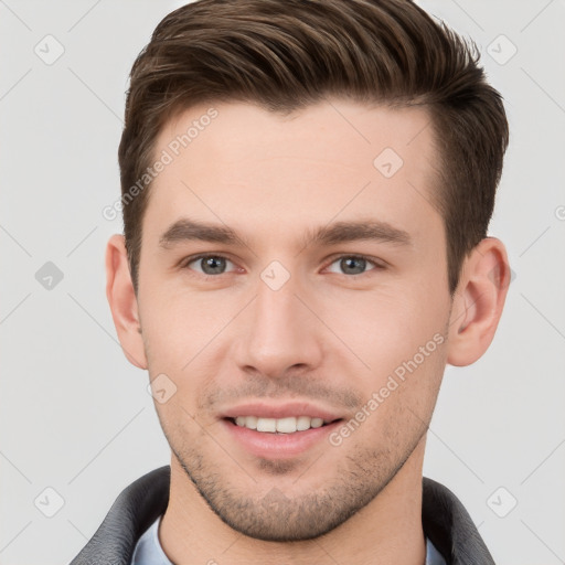 Joyful white young-adult male with short  brown hair and brown eyes