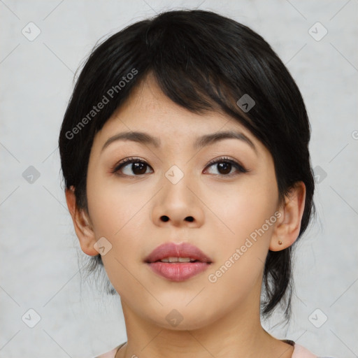 Joyful asian young-adult female with medium  black hair and brown eyes