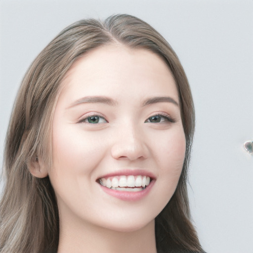 Joyful white young-adult female with long  brown hair and blue eyes