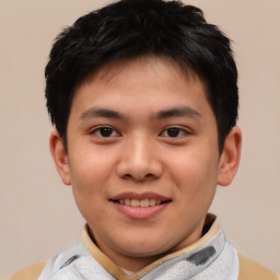 Joyful white child male with short  brown hair and brown eyes