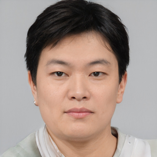 Neutral asian young-adult male with short  black hair and brown eyes