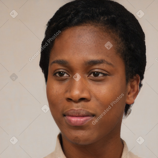 Joyful black young-adult female with short  black hair and brown eyes